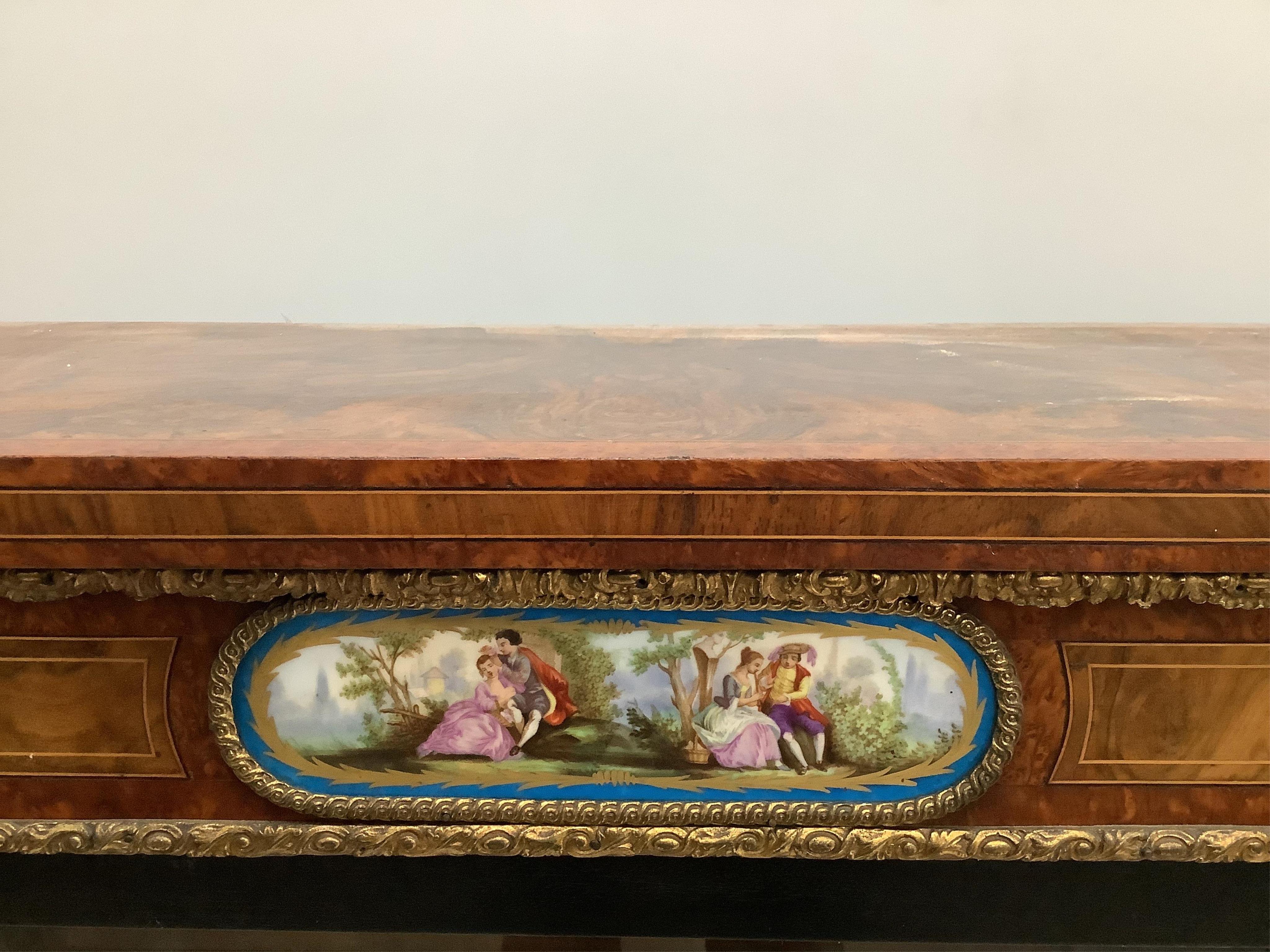 A Victorian amboyna banded figured walnut credenza, width 188cm, depth 44cm, height 109cm. Condition - fair to good